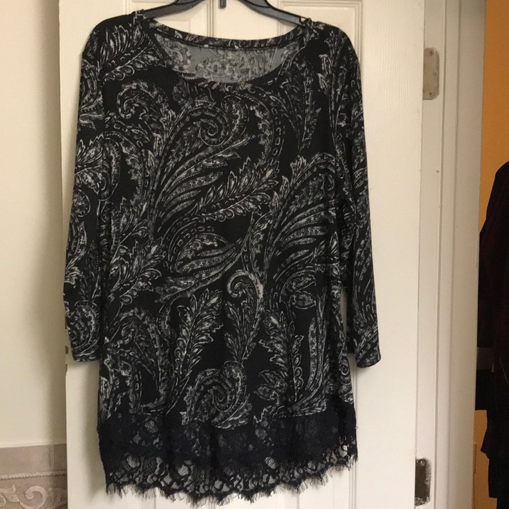 Black and cream blouse with lace hem.